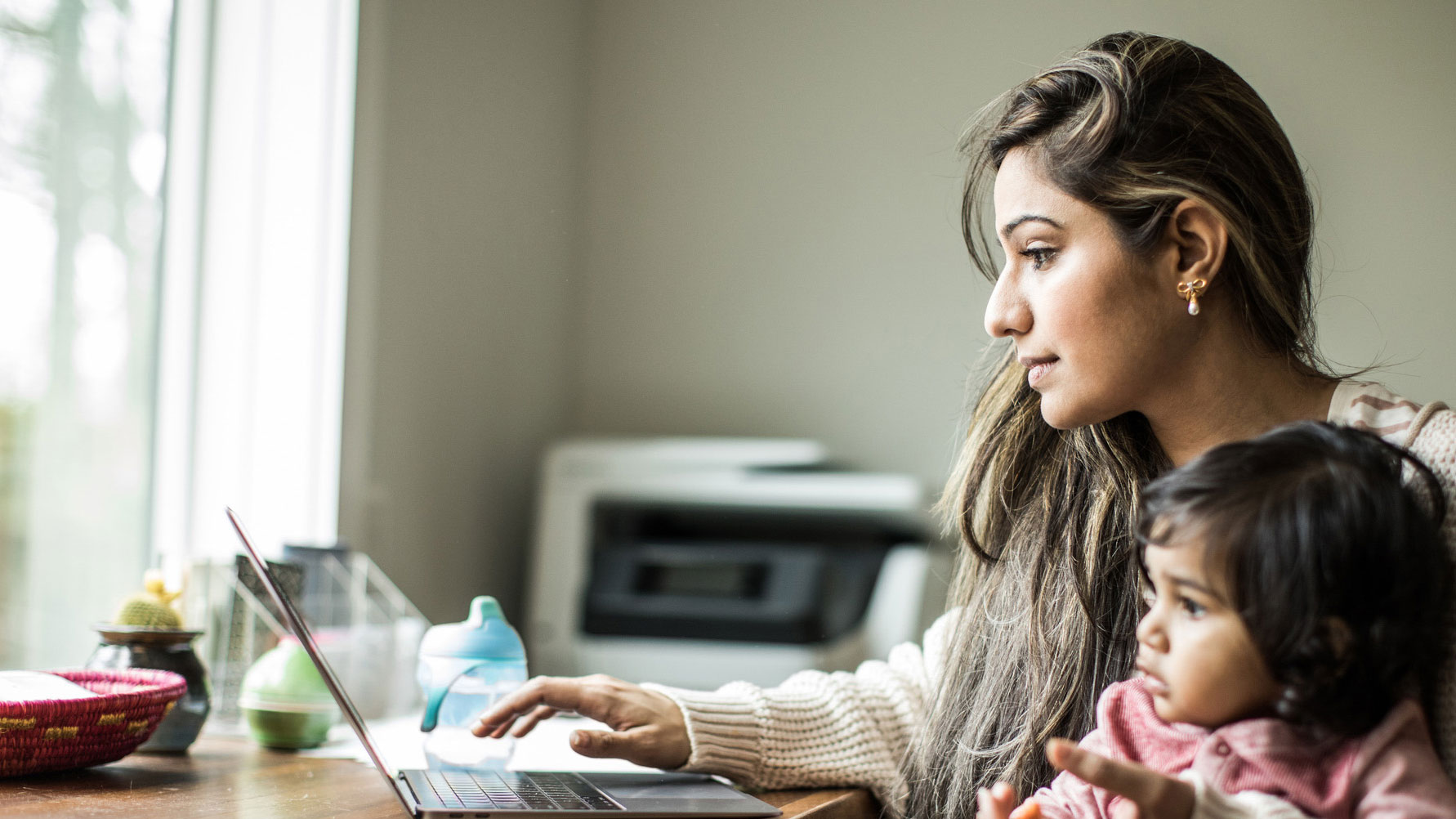 Women working from home with her daughter